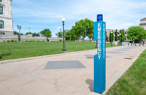 St PAUL, MINNESOTA / UNITED STATE  MAY 29 2023: The Blue Emergency Call Box In Front of State Capital of St Paul, MN