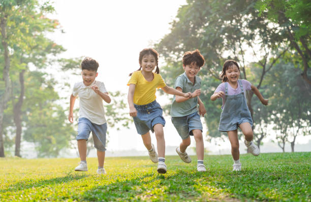 istock group image of asian children having fun in the park 1559538800