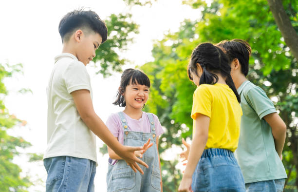 istock group image of asian children having fun in the park 1559539352