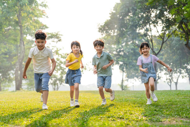 istock group image of asian children having fun in the park 1559539430
