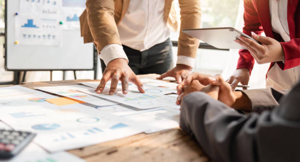 istock Business team analyzing income charts and graphs with modern laptop computer and digital tablet. Close up. Business analysis and strategy concept 1559541471