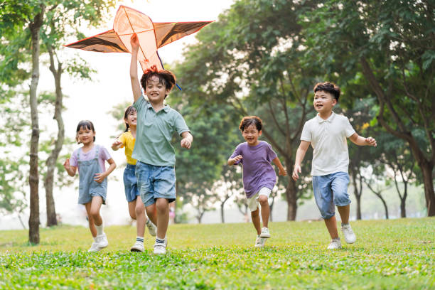 group image of cute asian children playing in the park group image of cute asian children playing in the park asian kid playing outdoor stock pictures, royalty-free photos & images