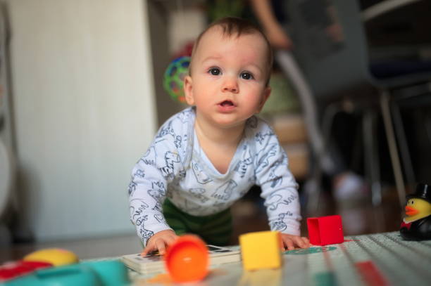 istock Little baby boy playing at home 1559566055