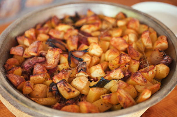 istock Baked potatoes with vegetables 1559566616