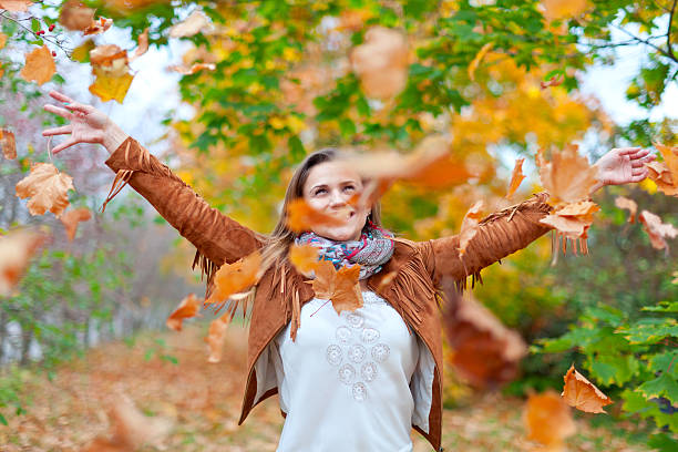 istock Happy woman throws  leaves 155956858