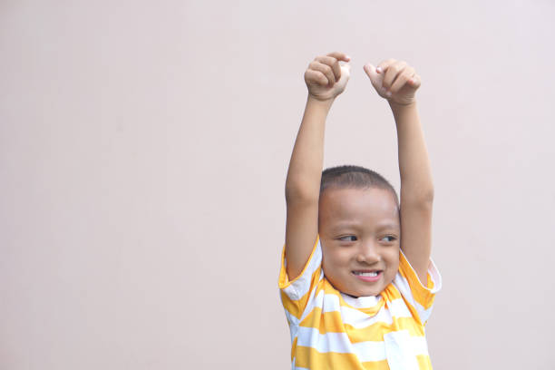istock Asian boy doing his hand as a great sign 1559568744