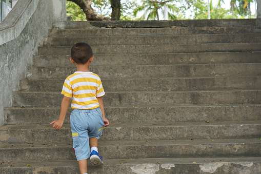 boy walking up the stairs