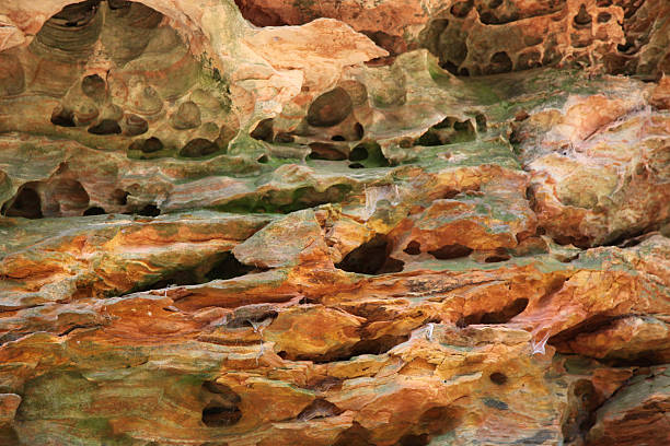 Ancient rock formations with mineral deposits stock photo