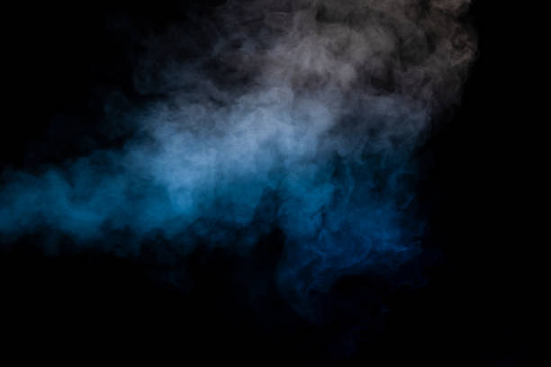 istock Blue and yellow steam on a black background. 1559629213