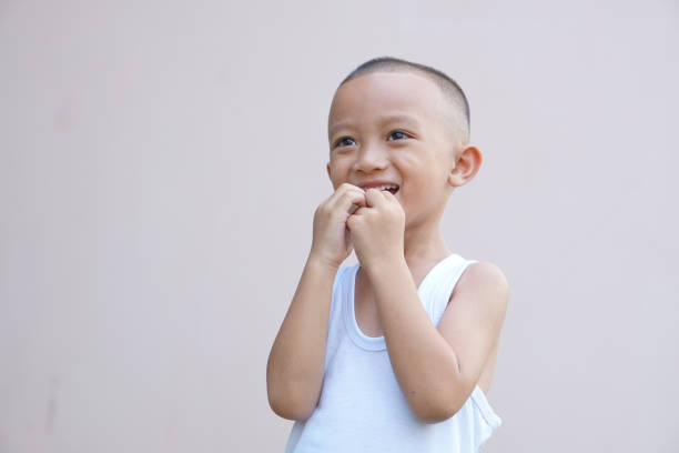 Asian boy smiling happily room wall background