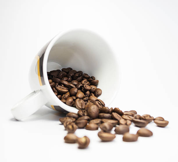 Coffee beans in a cup stock photo