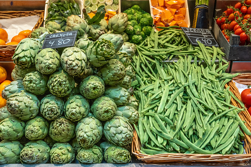 Artichokes and beans for sale at a market