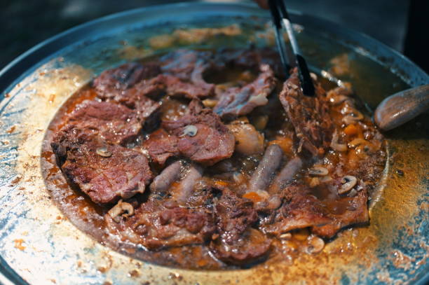 istock Pork meat on the barbecue plate 1559700399