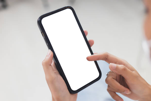 istock Mockup mobile phone blank white screen, hands holding smartphone empty display use for application information and advertise. searching data networks or chatting online. clipping path. 1559702181