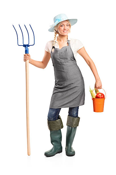 istock Female farmer holding a pitchfork and bucket 155970567