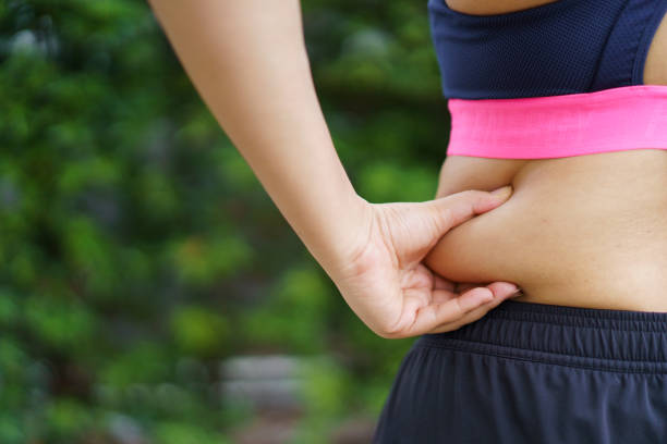 istock Woman exercising at the park. 1559725440
