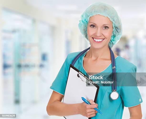 A Female Doctor In Scrubs With A Stethoscope And Clipboard Stock Photo - Download Image Now