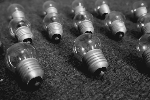 Groups of small light bulbs line the carpeted floor.