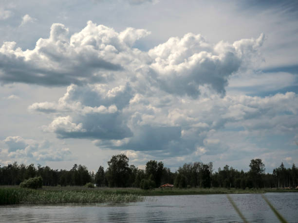 istock Beautiful landscape with river and clouds. 1559860827