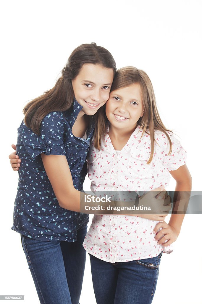 Dwie młode dziewczyny - Zbiór zdjęć royalty-free (Białe tło)