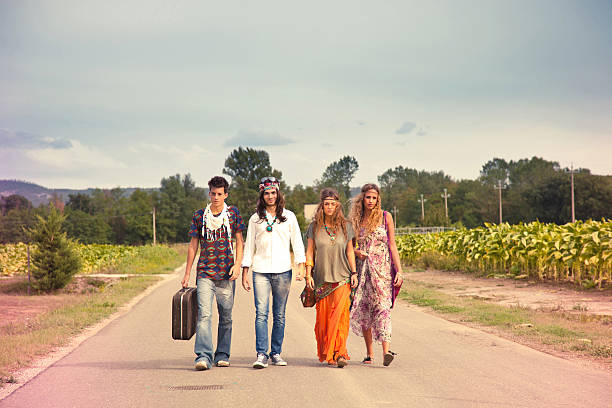 istock Hippie group walking on the road 155986682
