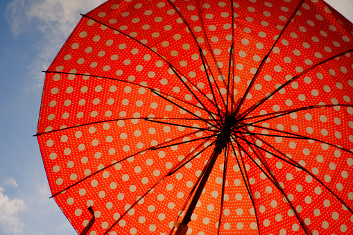 Bright and colorful polka dot Landscape umbrella. Colorful abstract art, against a bright blue sky background. Bandung - Indonesia. High Quality Photos