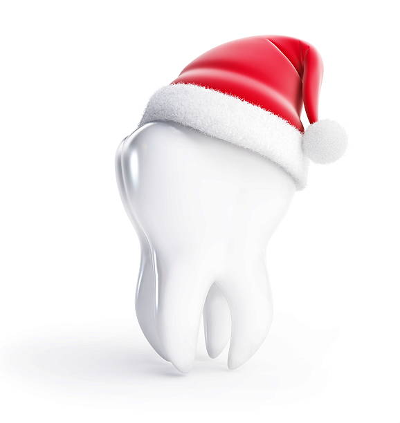 tooth santa hat on a white background stock photo