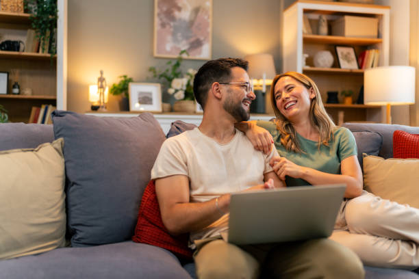 istock Man doing freelance work and getting distracted by beautiful wife 1559979774