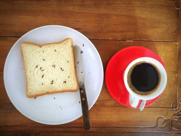 istock Preparing Breakfast Chocolaty Sandwich and Black Coffee 1559987874