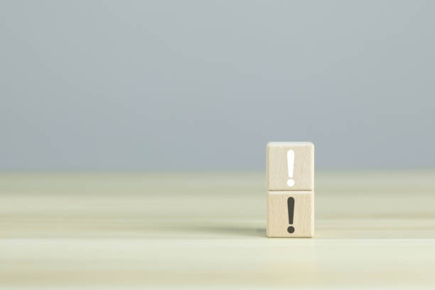 istock Exclamation mark on two wooden blocks 1559990569