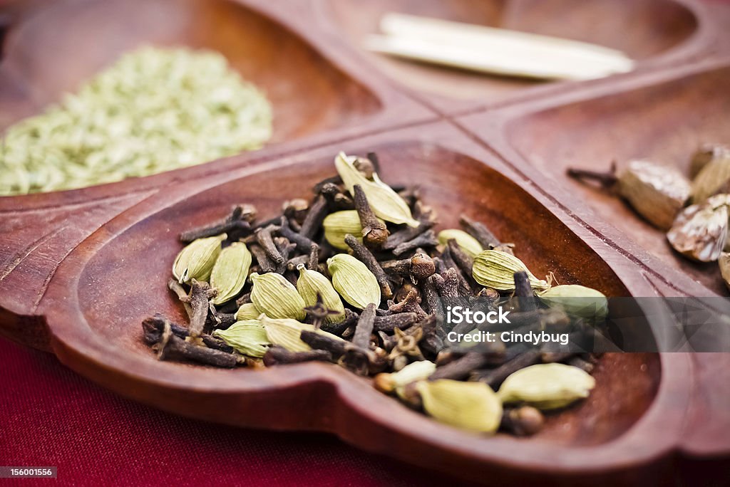 Cloves and Fennel Close up Close up on a tray of cloves and fennel served as an after dinner treat in Nepal. According to Ayurvedic practicioners cloves and fennel assist with digestion after a meal. Alternative Medicine Stock Photo