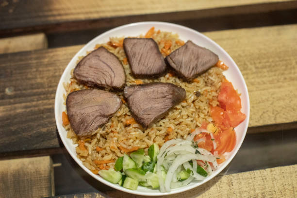istock Food in white plate on table. Delicious dish. Hot dinner. 1560015714