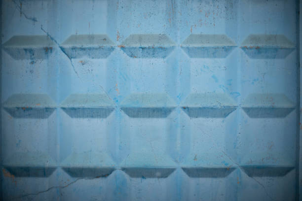 Checkered wall. Concrete fence. Blue background. Three-dimensional image.