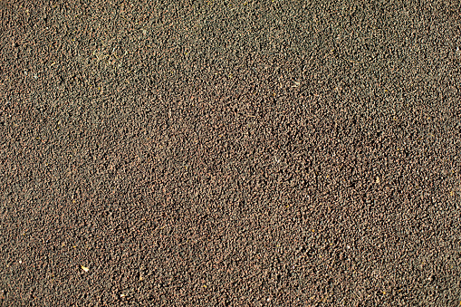 Texture of asphalt. Details of road. Grey background. Asphalt surface.