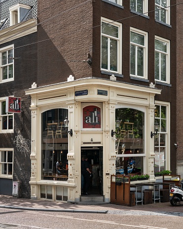 Amsterdam, Netherlands – August 15, 2020: A typical Amsterdam street during the daytime, showing a popular Turkish restaurant, Ali.