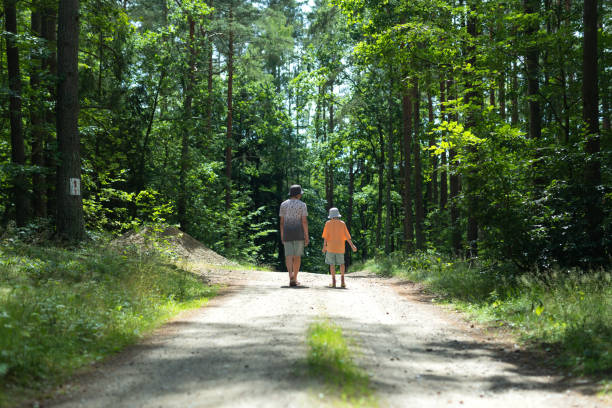 istock Young Boys walking in the forest 1560028880