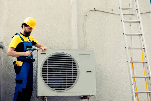 istock Repairman working on air conditioner 1560081121