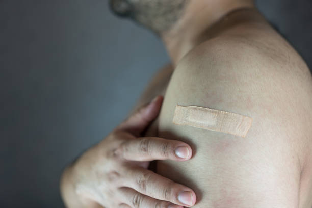 istock Plaster on man arm after vaccination 1560088730