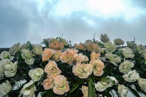 Close-up of elegant, artificial flower arrangement.