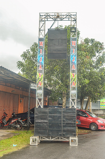 a sound system package assembled on iron sound rigging consisting of line array speakers and a large sub woofer in Tulungagung, Indonesia, 2 July 2023.