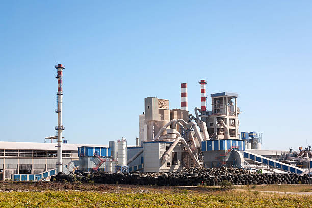 istock Rubber factory integrated into the landscape against blue sky 156011532