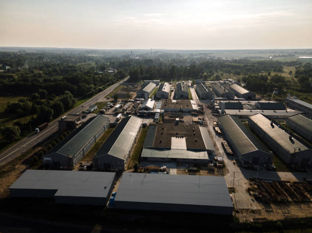 istock Aerial drone view of small warehouse at sunset 1560128738