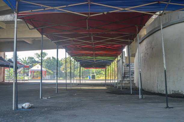 istock folding tents for bazaars lined up for bazaar preparation 1560143451
