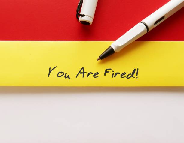 istock Pen writing on white yellow office envelope YOU ARE FIRED!, means worker getting fired from position, boss or employer indicated employees they are discharhed from job 1560174540