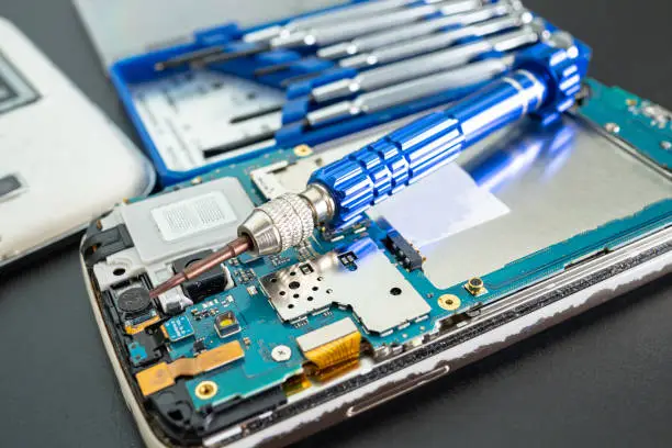 Repairing and upgrade Samsung mobile phone, electronic, computer hardware and technology concept.