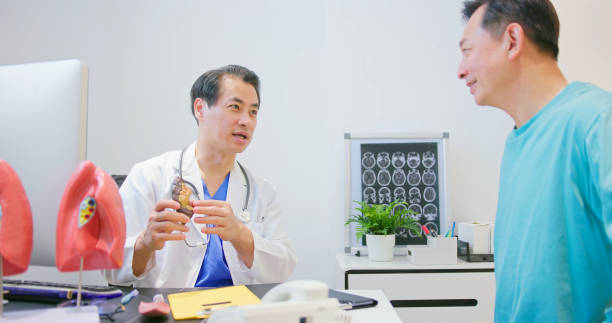 istock male doctor show lung model 1560210829