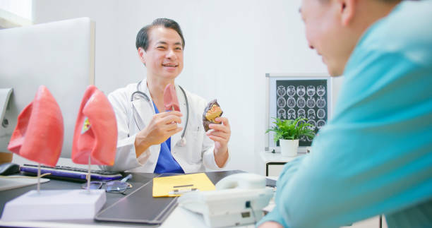 istock male doctor show lung model 1560210854
