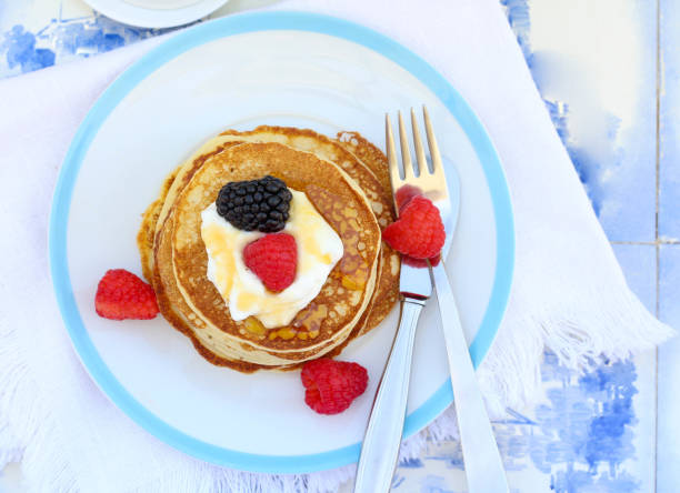 istock Sweet fritters with sour cream 1560225040