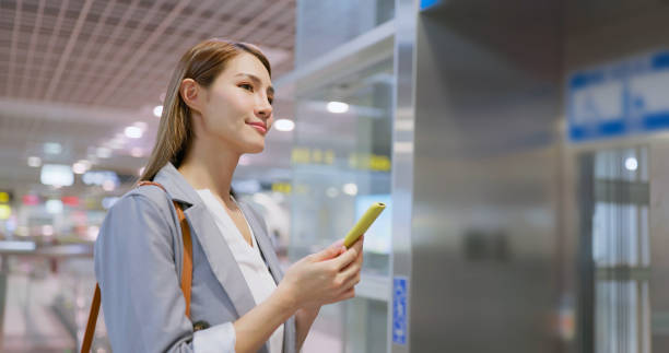 istock woman wait lift at station 1560233220