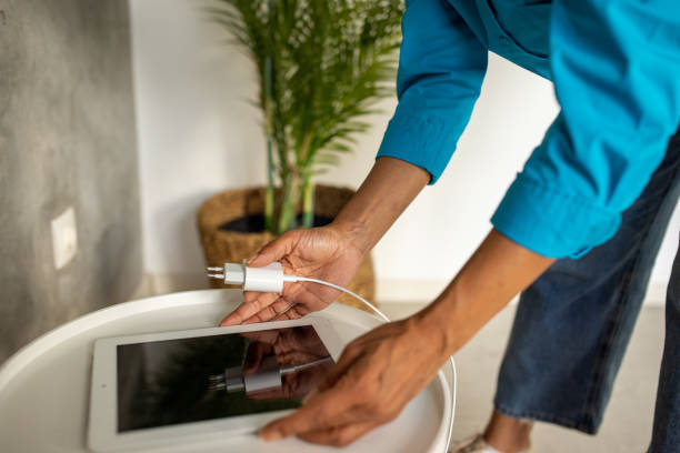 Tablet connected to the old book with a cable, and download information from there